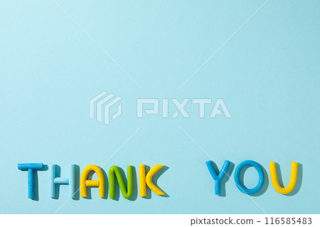 The word "thank you" from colored plasticine on a blue background. The word "thank you" from colored plasticine on a blue background. 116585483
