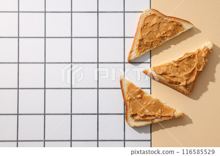Sandwiches with peanut paste, on a light background. Sandwiches with peanut paste, on a light background. 116585529