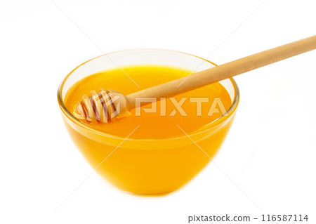 Honey pot and dipper isolated on white background as package design element Honey pot and dipper isolated on white background as package design element 116587114