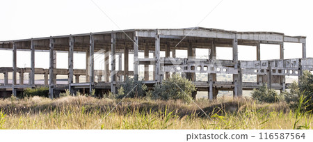 old USSR factory exterior, industry building is in a state of disrepair 116587564