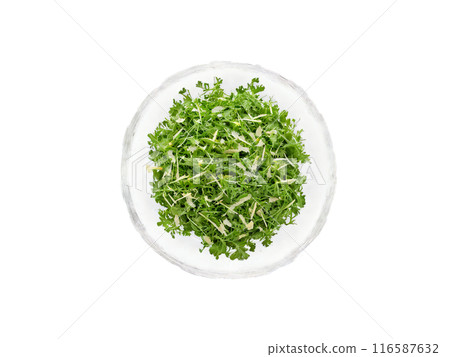 Salad arugula and parmesan with lemon vinaigrette served in a transparent glass bowl simple 116587632