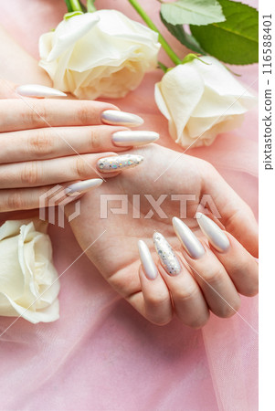 Female Hands with beautiful pearl manicure Female Hands with beautiful pearl manicure 116588401