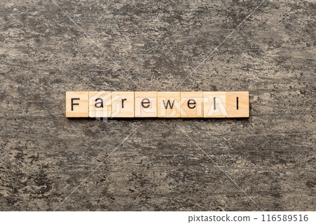 farewell word written on wood block. farewell text on table, concept farewell word written on wood block. farewell text on table, concept 116589516