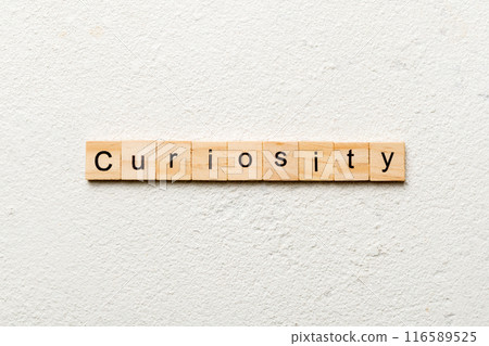 curiosity word written on wood block. curiosity text on table, concept 116589525