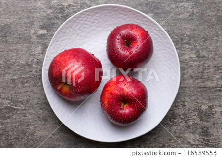 juicy red apples in a bowl or plate on the table top view. Copy space juicy red apples in a bowl or plate on the table top view. Copy space 116589553