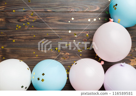 Background with fastive air balloons of round shape and confetti, multicoloured top view. Birthday party background Background with fastive air balloons of round shape and confetti, multicoloured top view. Birthday party background 116589581