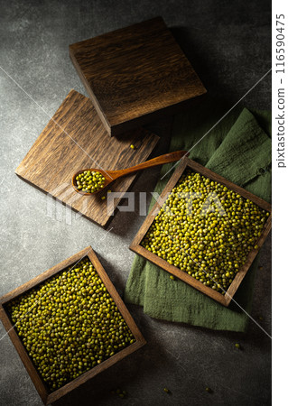green beans on a wooden spoon green beans on a wooden spoon 116590475