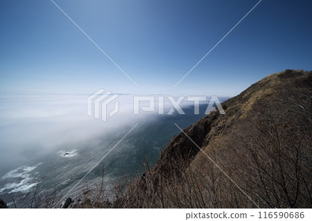 Early spring in Hokkaido: Looking out over the Pacific Ocean shrouded in sea mist from Cape Chikyu Observatory 116590686