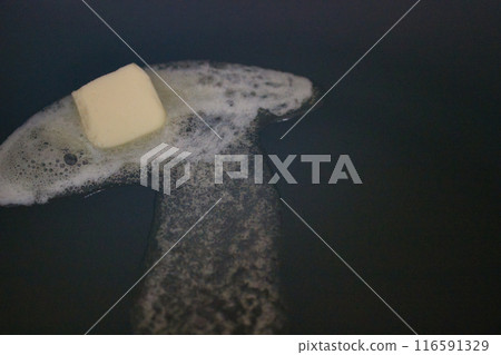 Melting Butter in Pan on Stovetop 116591329