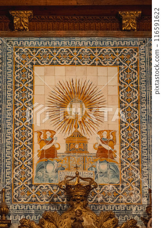 A large painting with a religious theme displayed on a wall in a room A large painting with a religious theme displayed on a wall in a room 116591622