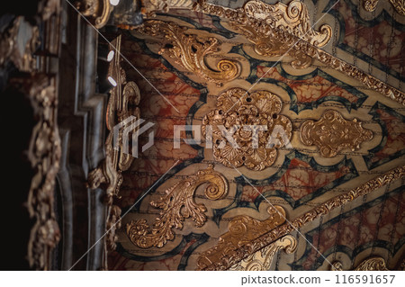 Ceiling with detailed carvings in wood and metal, creating a visual masterpiece Ceiling with detailed carvings in wood and metal, creating a visual masterpiece 116591657