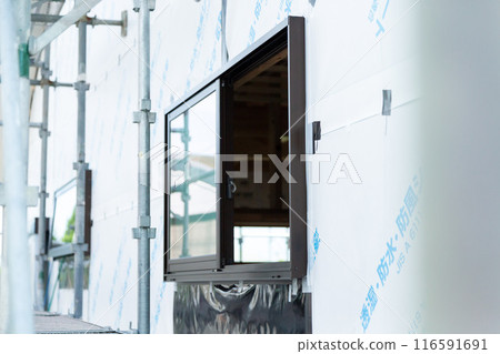 Exterior walls and windows at a new housing foundation construction site Exterior walls and windows at a new housing foundation construction site 116591691