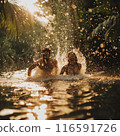 Beautiful couple splashing in a lake in the jungle 116591726