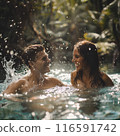Beautiful couple splashing in a lake in the jungle 116591742