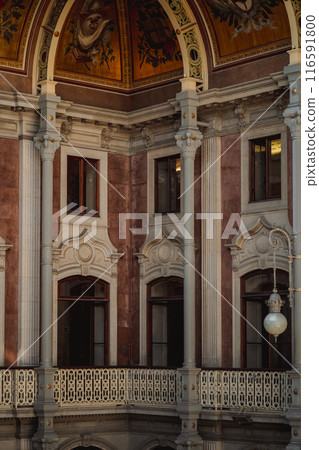 The interior of a structure featuring a balcony and pillars The interior of a structure featuring a balcony and pillars 116591800
