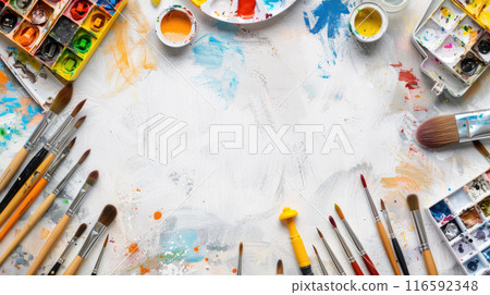 A flat lay of art supplies such as paint brushes, watercolor palettes, colored pencils, and sketchbooks. A flat lay of art supplies such as paint brushes, watercolor palettes, colored pencils, and sketchbooks. 116592348