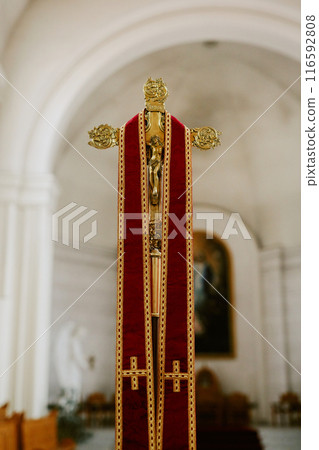 Vertical no people shot of crucifix in catholic church interior, copy space 116592808