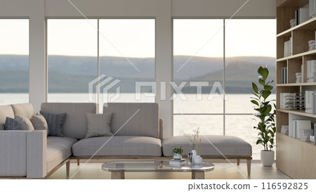 The interior design of a modern, bright living room features a comfortable L-shaped couch and decor. The interior design of a modern, bright living room features a comfortable L-shaped couch and decor. 116592825