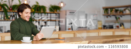 Cheerful guy trying new business app while sitting at cafe, using digital tablet, drinking coffee, panorama with copy space Cheerful guy trying new business app while sitting at cafe, using digital tablet, drinking coffee, panorama with copy space 116593808
