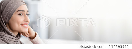 Future Business Leader. Closeup Portrait Of Smiling Arabic Woman In Hijab Resting Head On Hand And Looking Away, Selective Focus, Copy Space 116593913