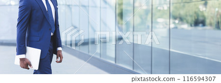 Unrecognizable Afro Business Guy Carrying Laptop Computer Going To Work In City. Cropped, Empty Space For Text 116594307