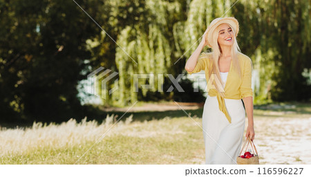 Young family walking at the park, father carrying daughter on shoulders Young family walking at the park, father carrying daughter on shoulders 116596227