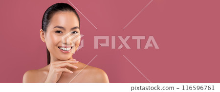 Closeup portrait of beautiful topless young chinese woman posing on purple studio background, touching her chin and smiling at camera, enjoying her smooth glow face skin, copy space Closeup portrait of beautiful topless young chinese woman posing on purple studio background, touching her chin and smiling at camera, enjoying her smooth glow face skin, copy space 116596761