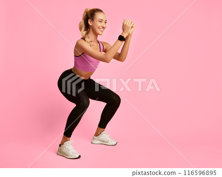 Workout Concept. Girl Doing Deep Squat Exercise On Yellow Background In Studio. Free Space 116596895