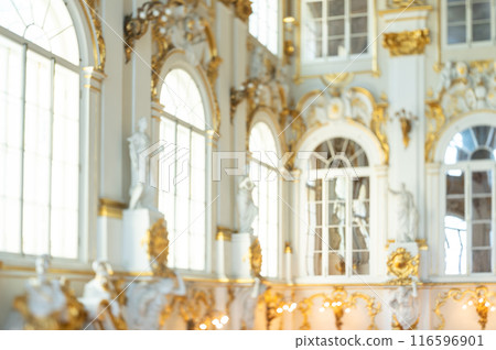 Blurred Luxurious Imperial Palace Interior, Opulent Golden Ornaments, White Sculptures, Grand Historical Architecture, Sunlit Elegant Space for Royal Ambiance Background 116596901