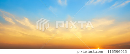 Panoramic View of Tranquil Sunset, Vibrant orange blue sky blending over horizon, delicate clouds scattered above, serene wallpaper, graphic design backdrop, sunset captured in panoramic view Panoramic View of Tranquil Sunset, Vibrant orange blue sky blending over horizon, delicate clouds scattered above, serene wallpaper, graphic design backdrop, sunset captured in panoramic view 116596913