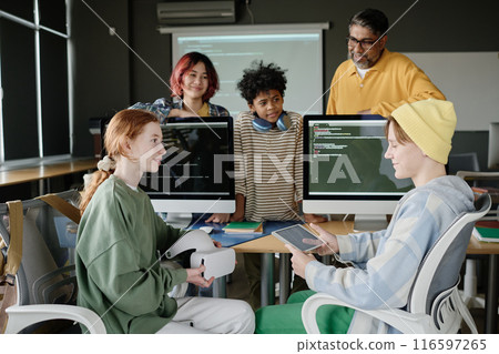 Teenagers using digital tablet and VR headset during modern Computer Science class at school Teenagers using digital tablet and VR headset during modern Computer Science class at school 116597265