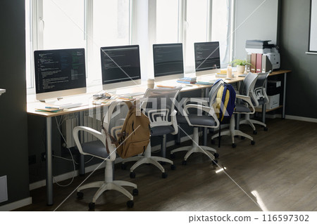 No people shot of modern IT classroom interior with modern computers on desks, copy space 116597302