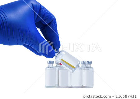 Blue gloved doctor hand holding a medicine bottle on white background. Blue gloved doctor hand holding a medicine bottle on white background. 116597431