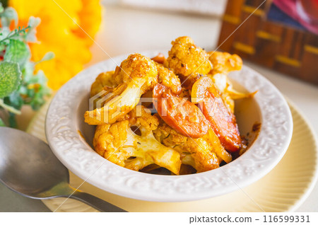 Stir-fried cauliflower and sausages 116599331