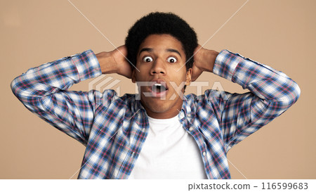 Wow. Guy with surpised expression looking at camera over white background Wow. Guy with surpised expression looking at camera over white background 116599683