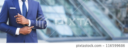 Business Life. Unrecognizable African American Man Adjusting Sleeve Cuff In City. Cropped, Free Space, Web-banner Business Life. Unrecognizable African American Man Adjusting Sleeve Cuff In City. Cropped, Free Space, Web-banner 116599686