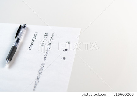 A handwritten resignation letter and a black gel ink pen on a white table 116600206