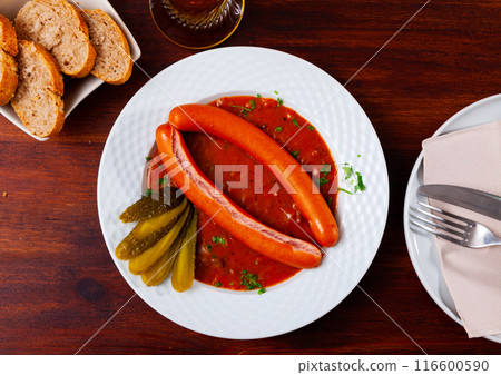 Wiener sausages with goulash sauce 116600590