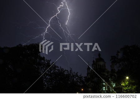Lightning in the night sky. Thunderstorm and lightning in the night sky. Lightning in the night sky. Thunderstorm and lightning in the night sky. 116600702