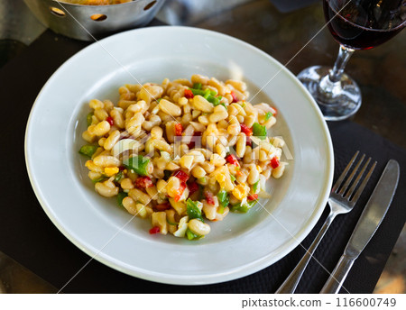 Traditional Catalan cold salad with white beans, cod and vegetables Traditional Catalan cold salad with white beans, cod and vegetables 116600749