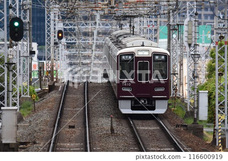 Hankyu Railway Kyoto Line Maroon train crossing the Yodo River Hankyu Railway Kyoto Line Maroon train crossing the Yodo River 116600919