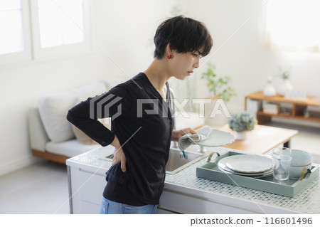 Woman in the kitchen Woman in the kitchen 116601496