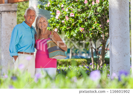 Happy Senior Retired Couple Smiling Outside in Sunshine Happy Senior Retired Couple Smiling Outside in Sunshine 116601902