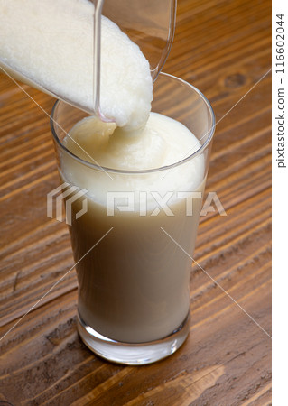 Pour the shake into a glass 116602044