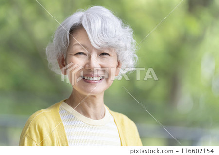 Senior woman looking at camera and smiling 116602154