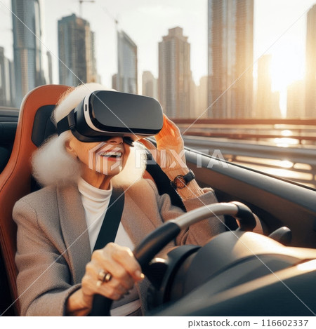 Senior woman driving a convertible car with virtual reality headset in a city 116602337