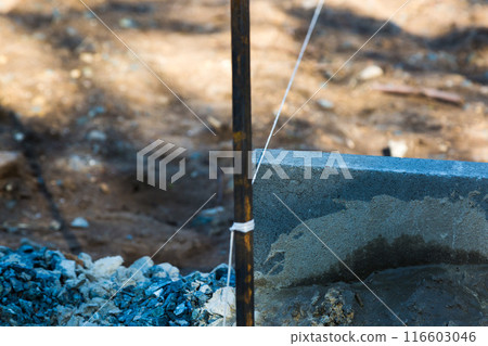 A roll of rope at a construction site for smooth laying of building material 116603046