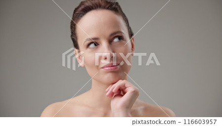 Concept of beauty, health, cosmetics, anti-aging therapy and skin care - young beautiful brunette Caucasian woman thoughtfully looks around making difficult choice thinking through actions Concept of beauty, health, cosmetics, anti-aging therapy and skin care - young beautiful brunette Caucasian woman thoughtfully looks around making difficult choice thinking through actions 116603957
