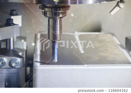 The CNC milling machine cutting mold parts with flat end mill tool in the light blue scene. The CNC milling machine cutting mold parts with flat end mill tool in the light blue scene. 116604162