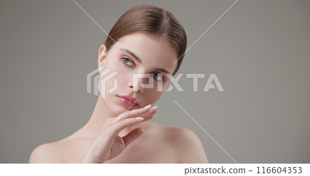Beauty, health, cosmetics, anti-aging therapy and skin care concept - young beautiful brunette Caucasian woman looking at the camera in a bad mood, upset and disappointed 116604353
